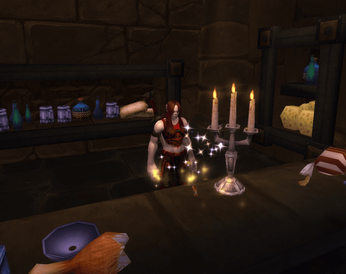 A Worldforged treasure sparkling beside a candleholder inside a storeroom